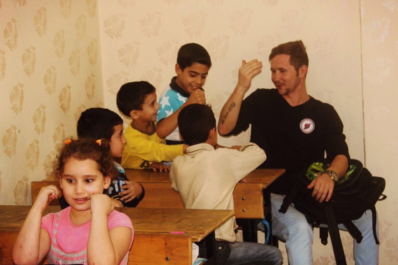 Mohammad Manla working with children